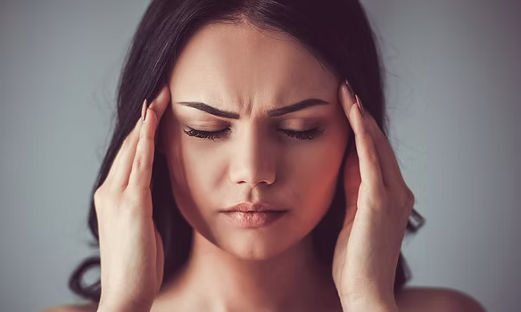 Patient consulting for headaches at the osteopathy practice Beirut
